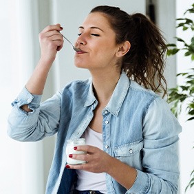 happy woman eating yogurt