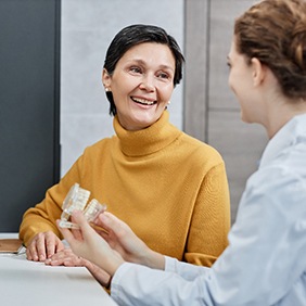 a patient speaking with a dentist