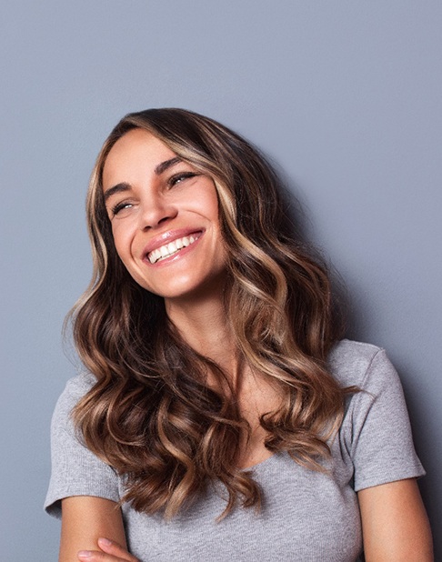 woman smiling with dental bridges in New York