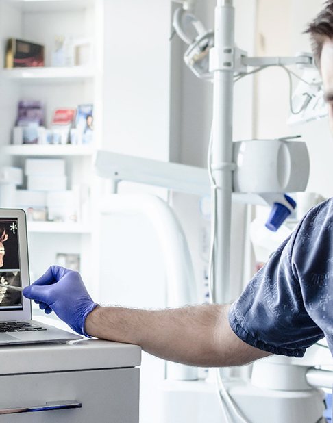 Dentist showing patient their X-rays