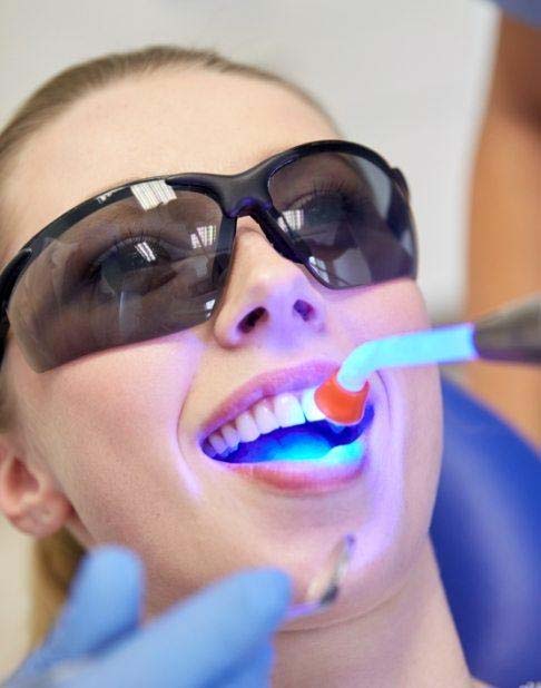 Patient receiving dental bonding treatment