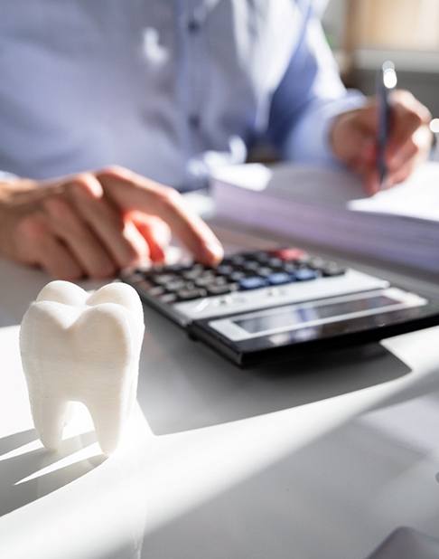  Calculator and cash on table