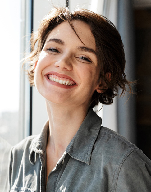 woman smiling with dental crowns in New York