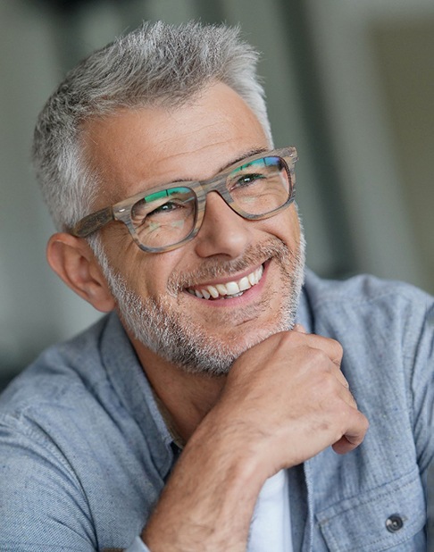 a mature man smiling with dentures in New York