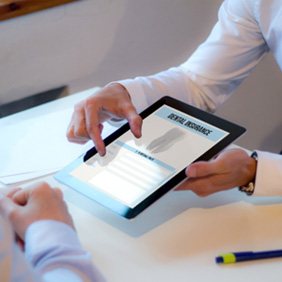 An insurance agent discussing dental insurance with a patient