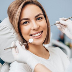 Woman smiling during a dental checkup