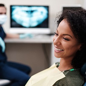 a smiling woman at the dental office