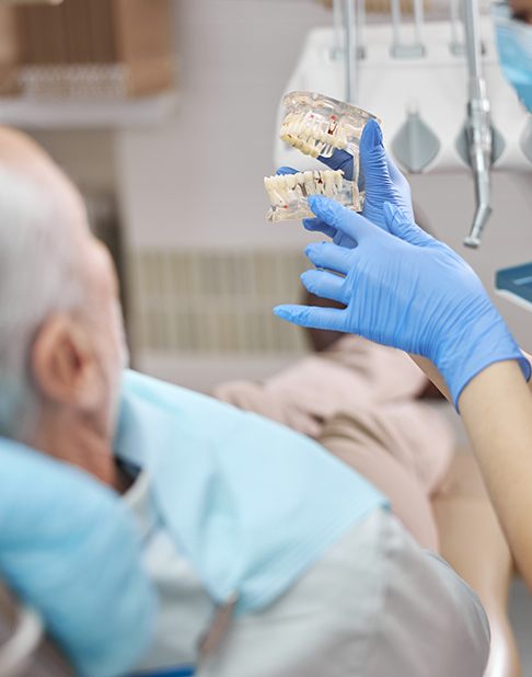 a patient speaking with their dentist
