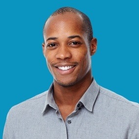 Smiling man wearing collared shirt