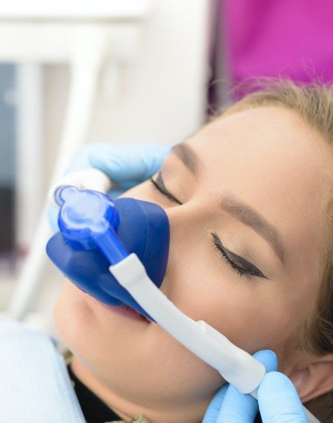 Patient receiving nitrous oxide sedation dentistry