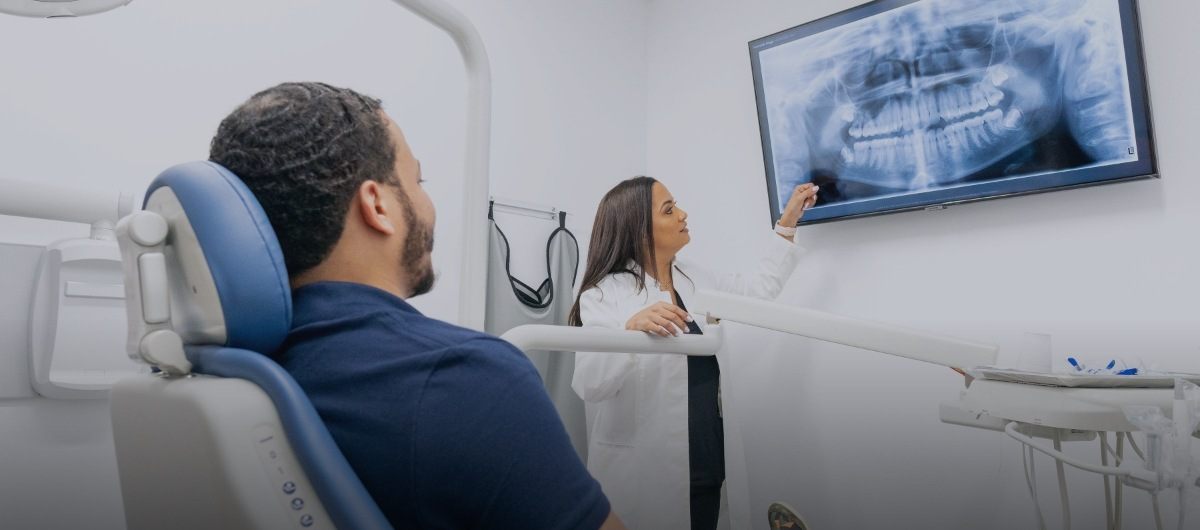 Dentist and patient discussing emergency dentistry treatment