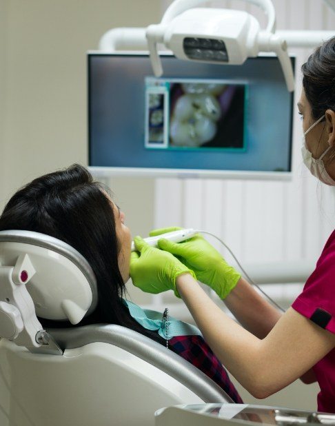 Dentist using intraoral camera to capture smile images