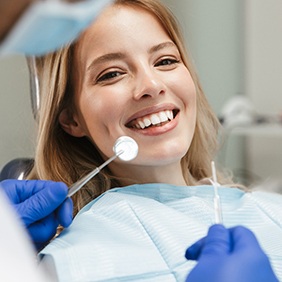 patient smiling during consultation in New York