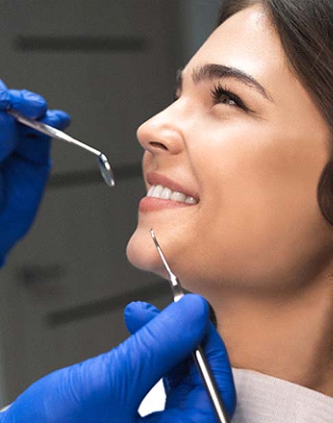 patient smiling after getting veneers in New York