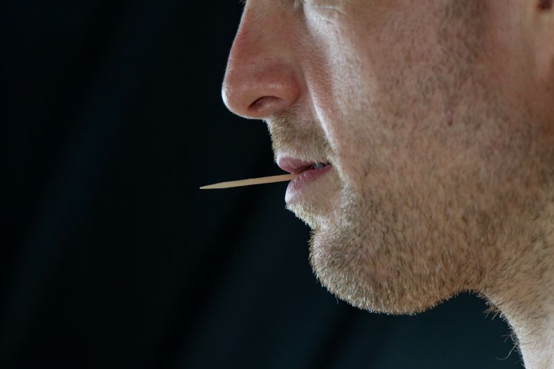 Man with toothpick