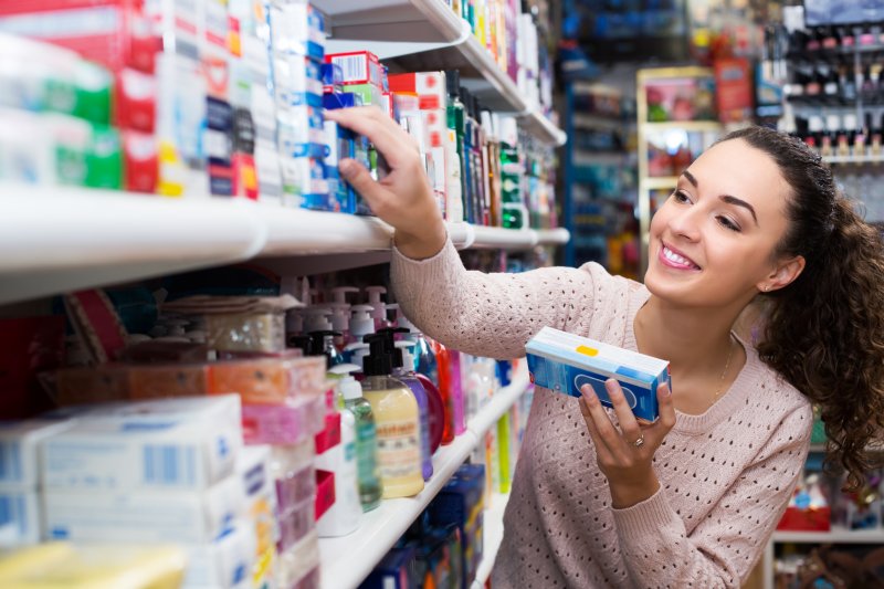 A woman buying teeth whitening supplies