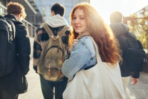 Teenager in group smiling.